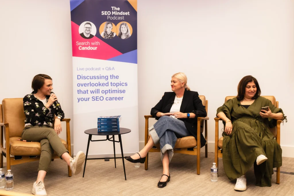 Sarah, hosting the SEO Mindset Live podcast during brightonSEO, with co-host Tazmin Suleman, and guest Willow Mack.